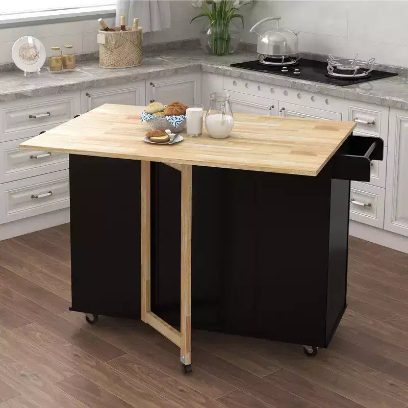 JVNOXK Îlot de cuisine avec range-épices, porte-serviettes et plateau extensible en bois massif, roulettes verrouillables et espace de rangement, noir