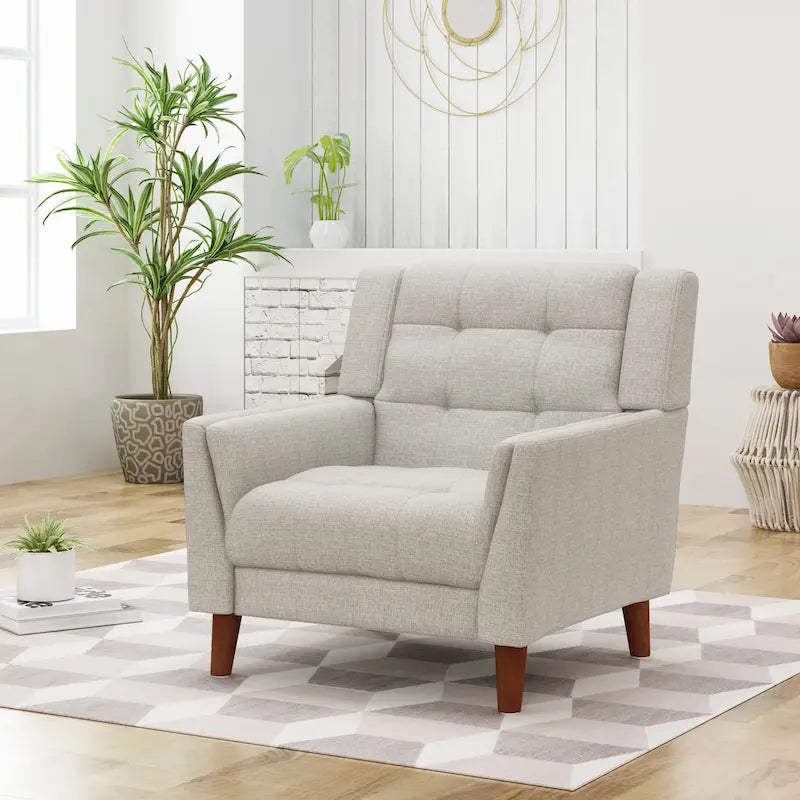 Fauteuil rembourré à dossier capitonné